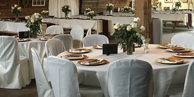 round tables with white chairs at the barn at chestnut ridge round tables with white chairs at the barn at chestnut ridge