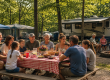 Multi-generational family enjoying a reunion picnic and campfire at Chestnut Ridge Campground in Hubbard, Ohio